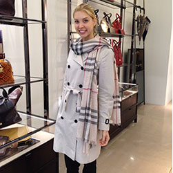 Hostess in a luxury fashion showroom surrounded by designer handbags and accessories &mdash; fashion event staff in New York