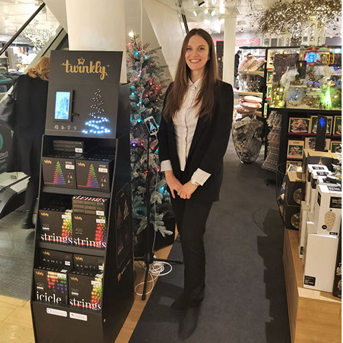 Hostess presenting Twinkly smart LED lighting at a retail display &mdash; promotional staff in New York