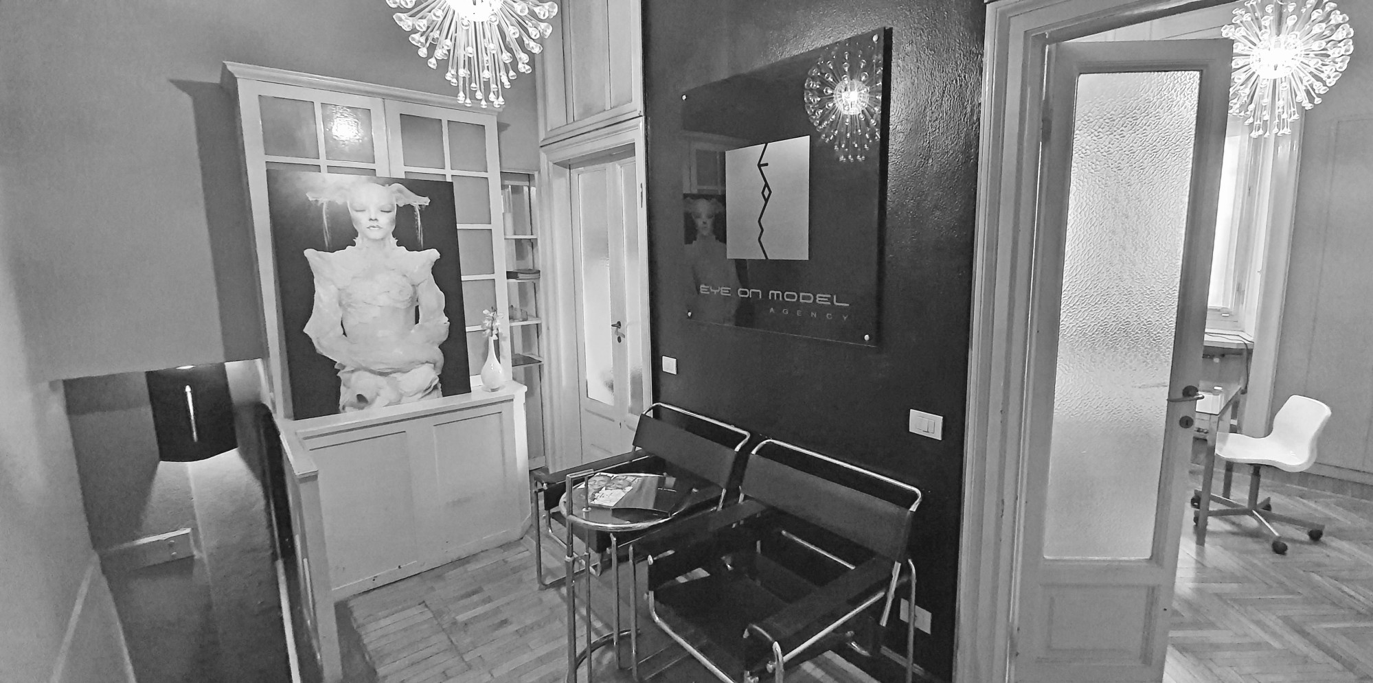 Eye On Model reception area with classical sculpture and agency logo