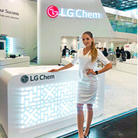 Trade show hostess assisting visitors at a New York exhibition booth